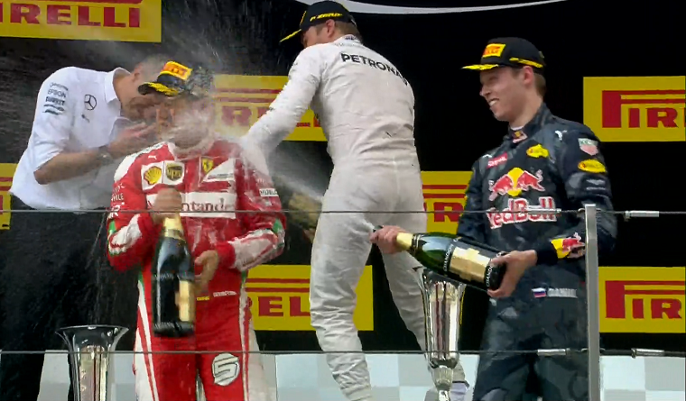 Kvyat sprays Vettel with champagne