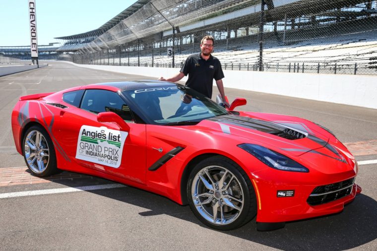 John Green poses with a 2016 Chevy Corvette Stingray Coupe pace car at Indianapolis Motor Speedway