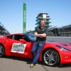 John Green poses with a 2016 Chevy Corvette Stingray Coupe pace car at Indianapolis Motor Speedway