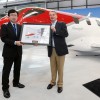 Honda Aircraft Company President and CEO Michimasa Fujino participates in a ceremonial delivery with Johannes Graf von Schaesberg, chairman and CEO of Rheinland Air Service.