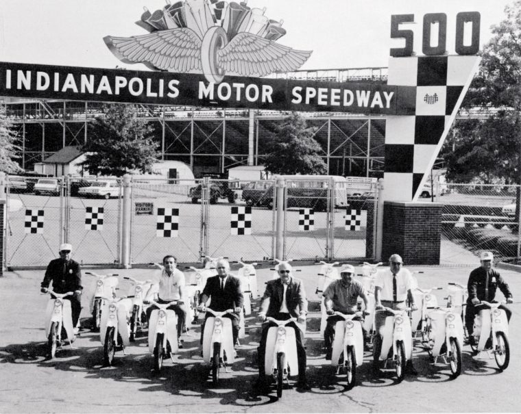 Officials at the 1965 Indy 500 prepared to test ride a fleet of Honda motorcycles