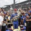 Honda's Alexander Rossi celebrates his Indy 500 win in Victory Circle.