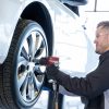 Chevrolet certified mechanic fitting a tire onto a vehicle