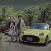 A mixed Japanese family next to a Toyota