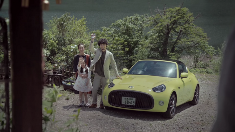 A mixed Japanese family next to a Toyota