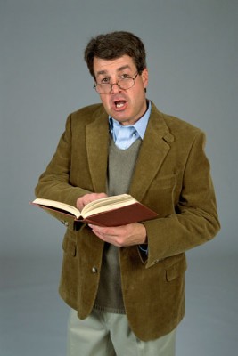 Teacher professor in brown coat glasses with book