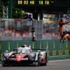 The Toyota #5 TS050 Hybrid at a stop near the pit wall.