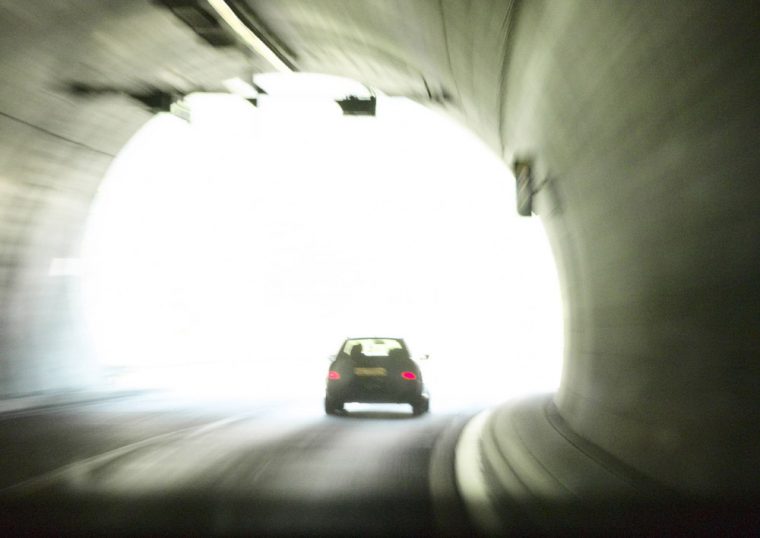 car driving through tunnel