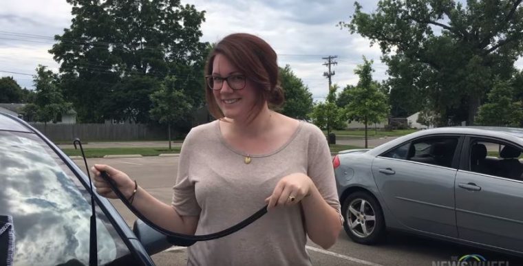 Woman Changing Windshield Wiper