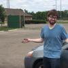 Daniel Susco with dirt all over his hands