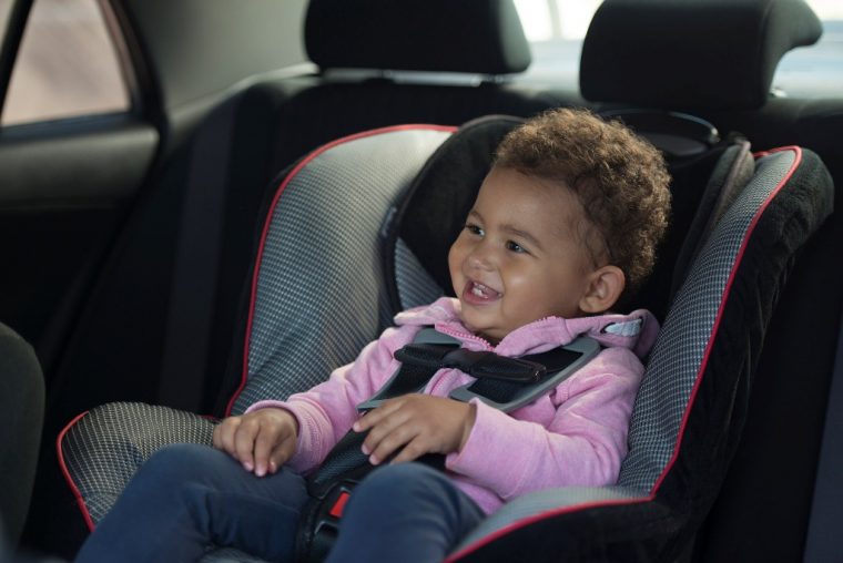 baby girl in car seat