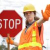 crosswalk girl red stop sign directing traffic