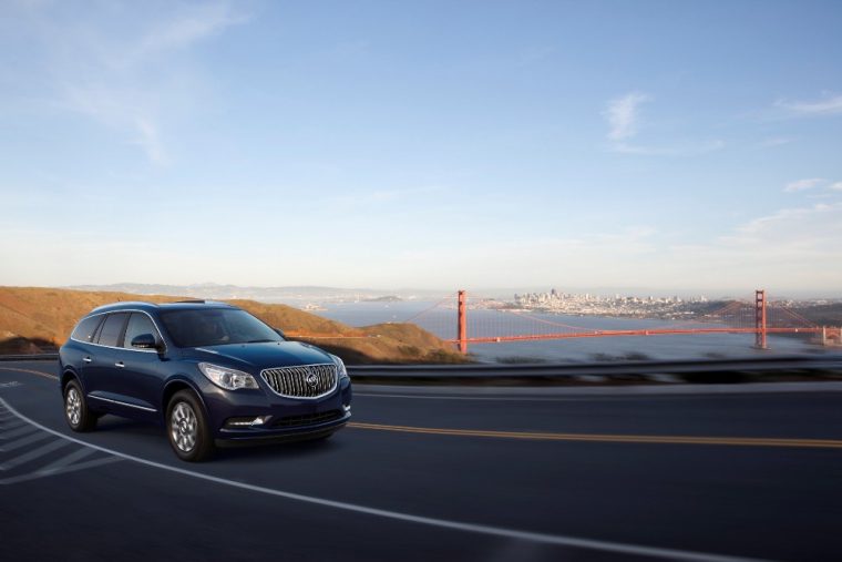 The 2017 Buick Enclave driving along a road with Golden Gate Bridge in background