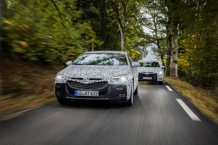 A camouflaged Opel Insignia Grand Sport is tested ahead of the 2017 Geneva Motor Show