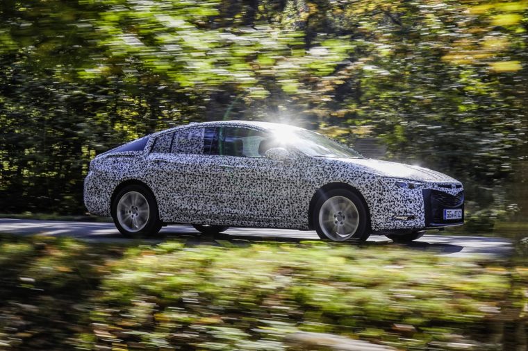 A camouflaged Opel Insignia Grand Sport is tested ahead of the 2017 Geneva Motor Show