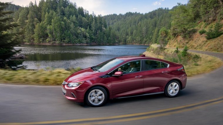 The 2017 Chevy Volt driving by a lake