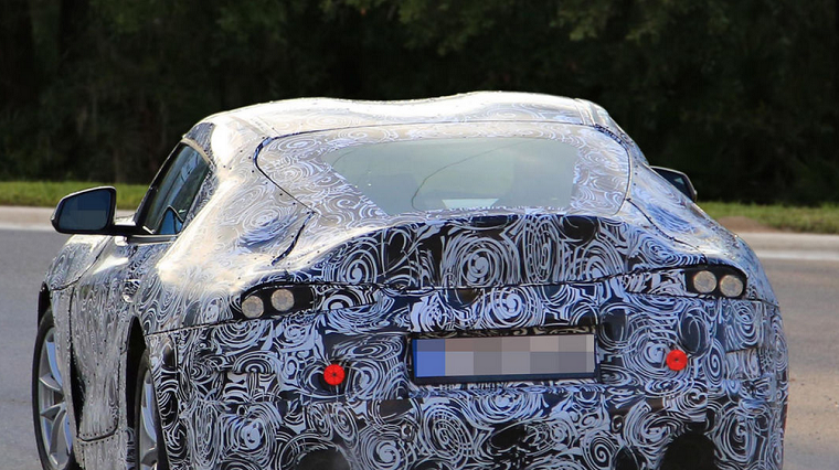 Spy shot of a camouflaged Toyota Supra mule car