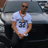 T.I. and his GMC Yukon Denali