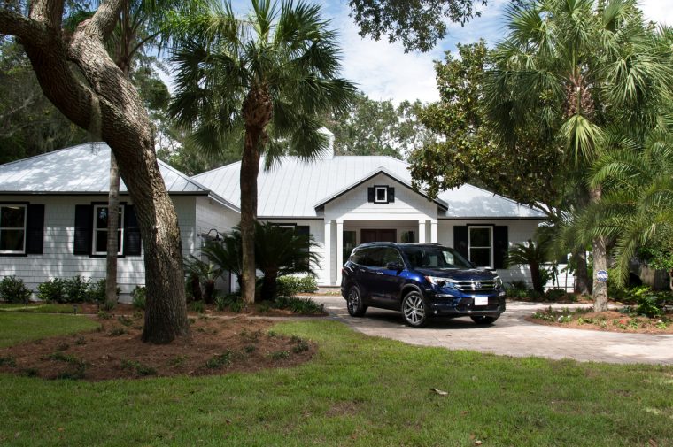 A 2017 Honda Pilot Elite parked in front of the the HGTV Dream Home 2017