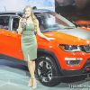 Woman model posing beside Jeep Compass at Auto Show