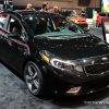 2017 Kia Forte black hatchback car on display Chicago Auto Show