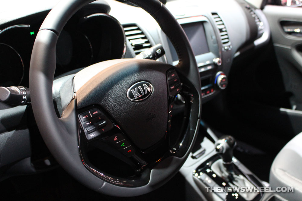 2017 Kia Forte black hatchback car on display Chicago Auto Show