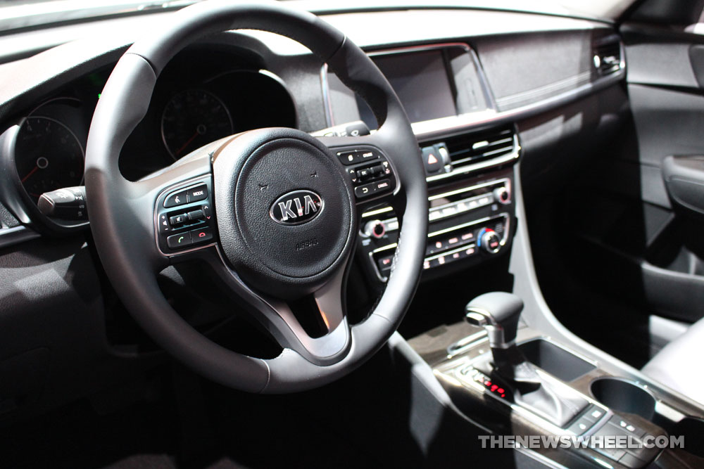 2017 Kia Optima white sedan car on display Chicago Auto Show