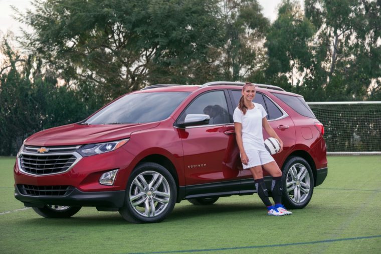 Gold Medalist Alex Morgan poses with a Chevy Equinox