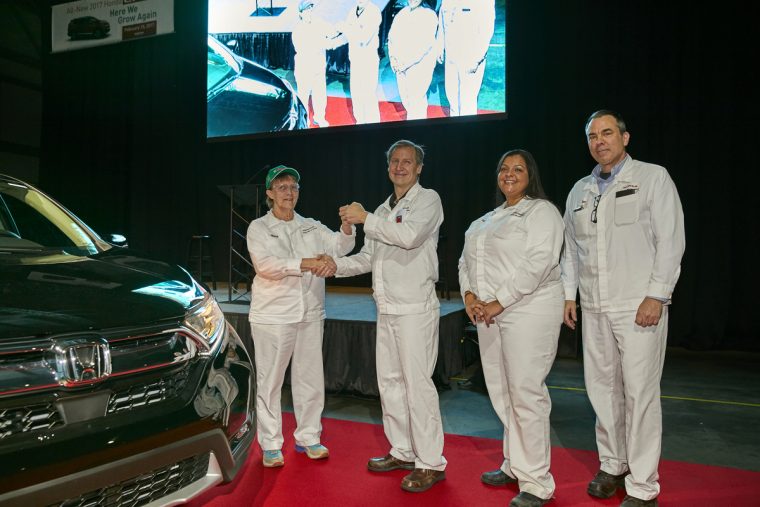 Honda Manufacturing of Indiana President Bob Nelson accepts the key for the first all-new 2017 CR-V built at the Greensburg plant.