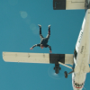 Jeremy Renner jumping out of a plane