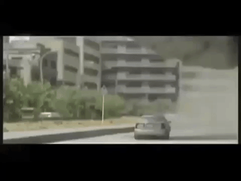 Classic Godzilla foot stomps cars in traffic gif