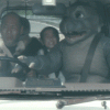 Godzilla son Minilla driving car