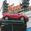 A red 2018 Chevy Equinox being put above Chevrolet Fountain at Comerica Park