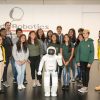 City Year students pose with Honda's ASIMO humanoid robot at a recent STEM education event.