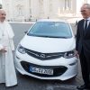 Pope Francis poses with Opel Ampera-e and Opel CEO Karl-Thomas Neumann at Vatican