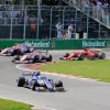 Sebastian Vettel passes Esteban Ocon at the 2017 Canadian Grand Prix