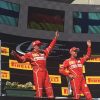 Raikkonen and Vettel wave on the podium