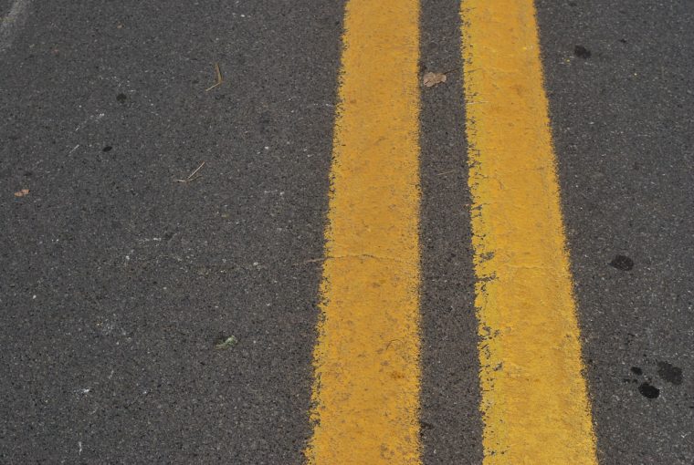 diagonal lines on the pavement warn drivers of