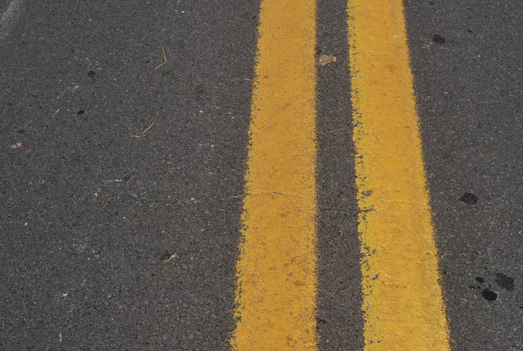 diagonal-lines-on-the-pavement-warn-drivers-of-perkiller