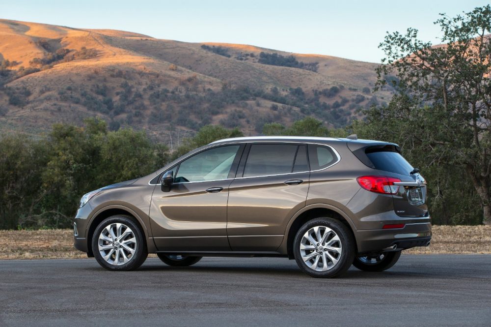 The 2018 Buick Envision parked in front of a hill