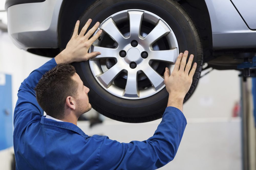 mechanic changing tire