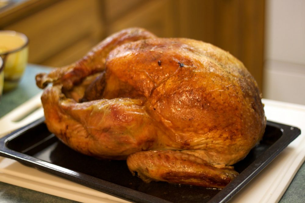 a roasted turkey in a pan