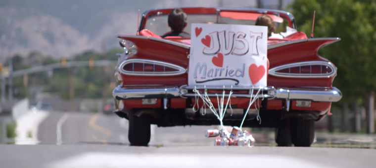 wedding newlyweds car