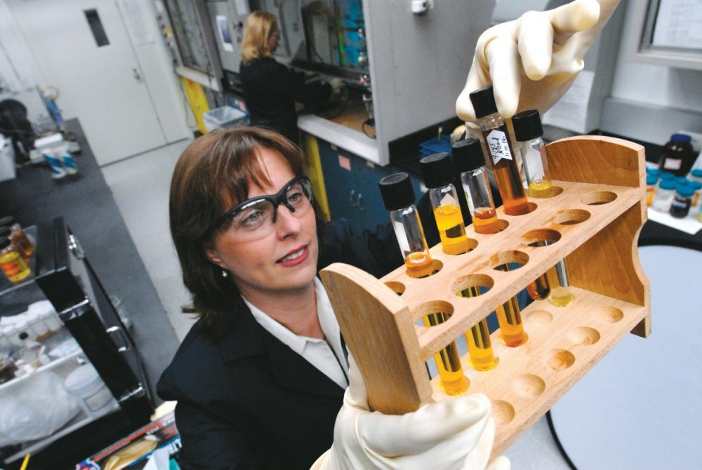 Ford Technical Leader of Plastics Research Debbie Mielewski observes a polyol separation in the laboratory