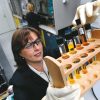 Ford Technical Leader of Plastics Research Debbie Mielewski observes a polyol separation in the laboratory