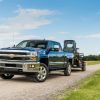 2018 Silverado 2500 HD Deep Ocean Blue Metallic LTZ Z71 Crew Cab towing John Deere Skid Steer with a Big Tex Trailer. Towing 10,808 pounds (total weight of trailer and equipment combined).