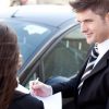 car salesman used car paperwork