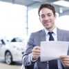 car salesman used car paperwork 2