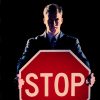 Guy holding Stop Sign