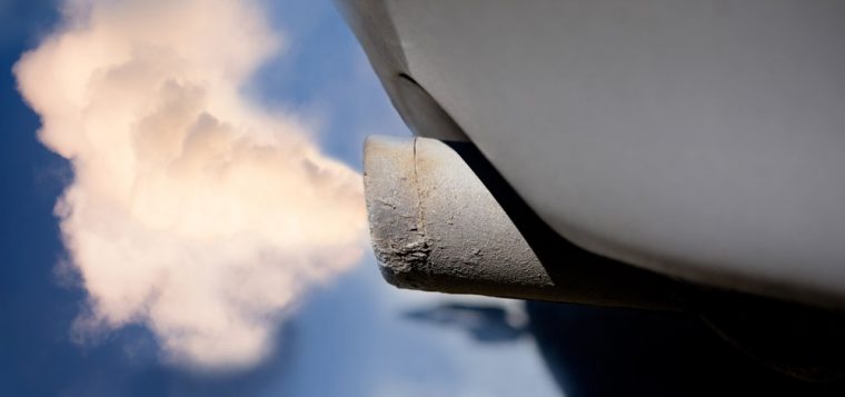 Exhaust emissions coming from a car tailpipe